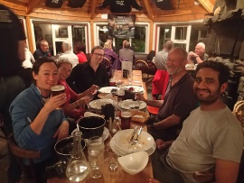 Enjoying a meal and a beer after a days kayaking in The Old Forge pub, Inverie, Knoydart.